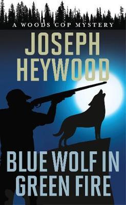 Coperta cărții 'Blue Wolf in Green Fire: A Woods Cop Mystery - Joseph Heywood'
